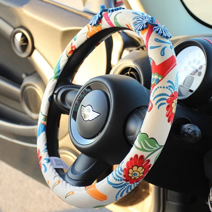 a pair of shoes sitting on a steering wheel 